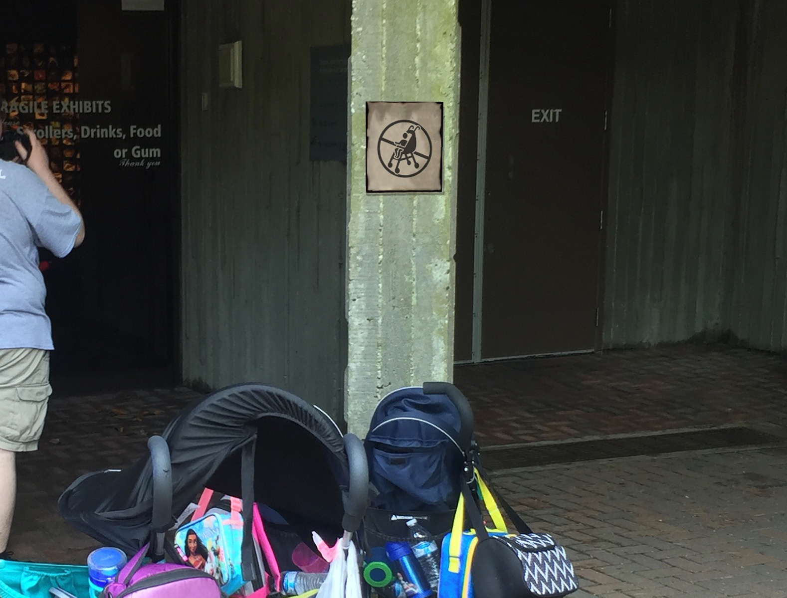 no strollers sign on building
